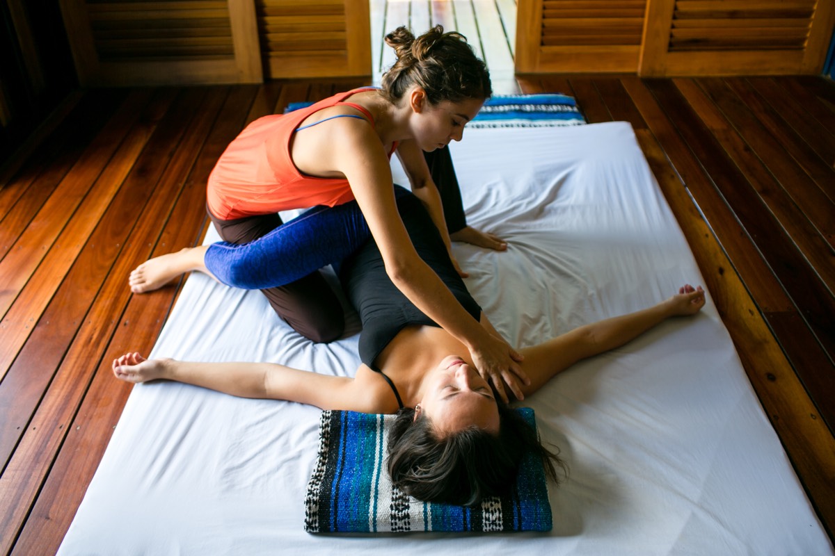 Thai yoga massage combining yoga and therapeutic touch